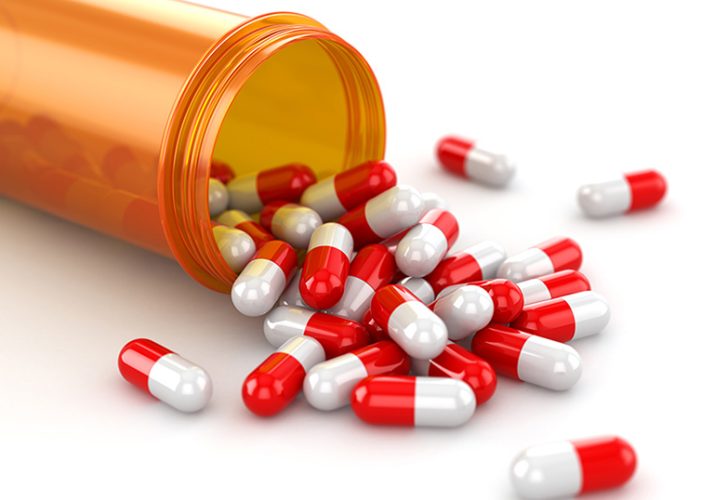 Medicine concept. Spilled pills from prescription bottle. 3d