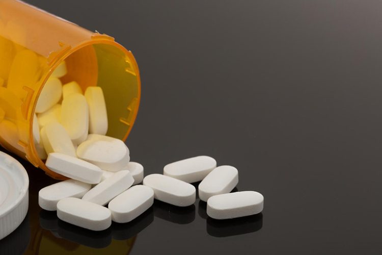 Pills spilled out on table